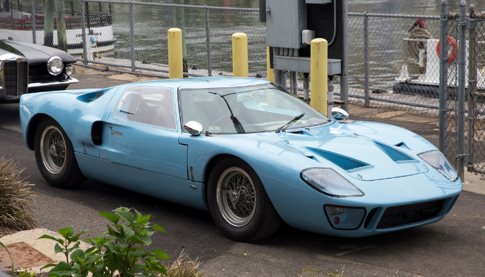 Baby Blue Ford GT40 against some railings