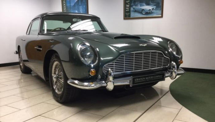 SIlver Aston Martin DB5 in a showroom 