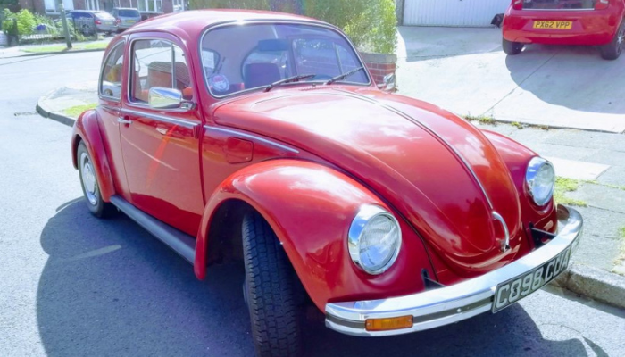 very late registered red Volkswagen Beetle in red